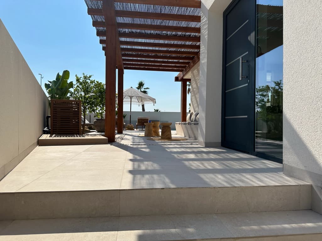 Villa Bella Sol — bright living room with French doors to the terrace
