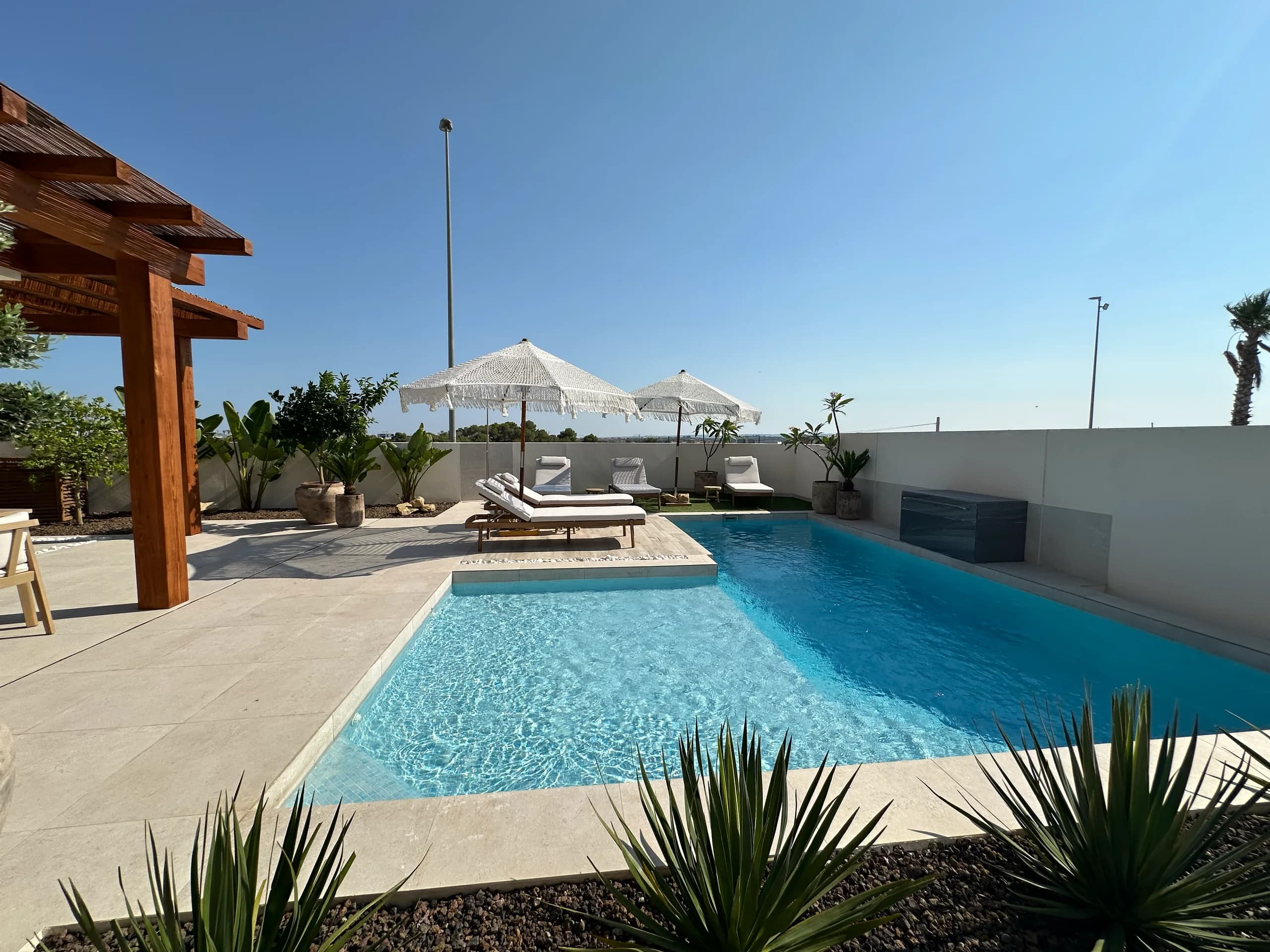 Villa Bella Sol — bedroom with crisp linens and calm tones